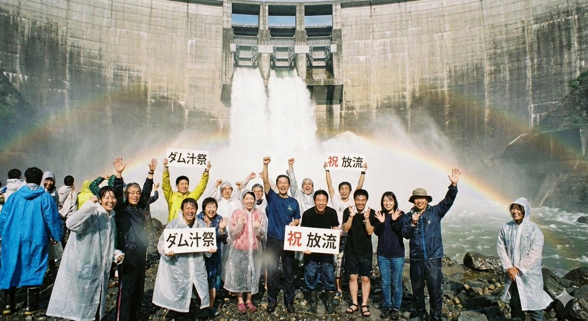 An image generated only from the phrase “people who are happy to be drenched in dam water directly beneath a dam during a spill.” The people are all fictional. 🍌 Amazing, but the images and videos are already…