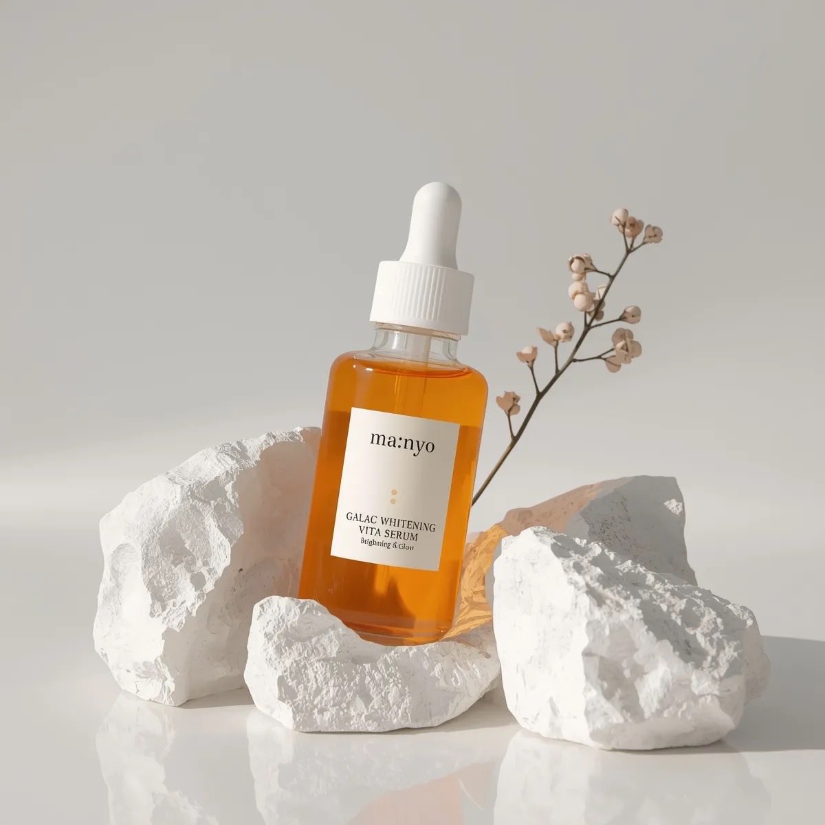 Minimalist studio product photography of an amber glass dropp...